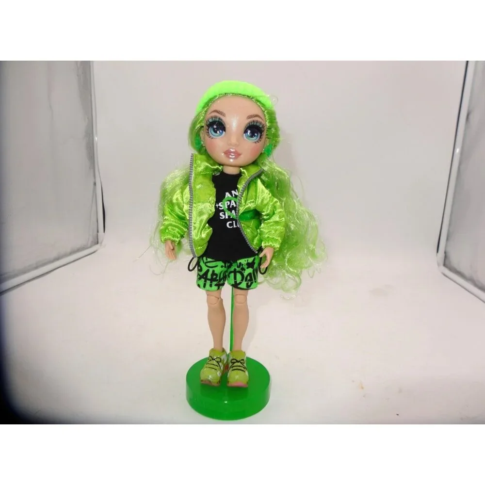 Rainbow High Jade Hunter Fashion Doll Dressed in Shorts Hat Jacket Top and Stand